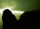 Sea, black mountain,